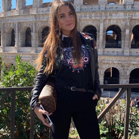 MIna Bonino posted a picture holding a designer bag during her vacation in Roma, Italia.